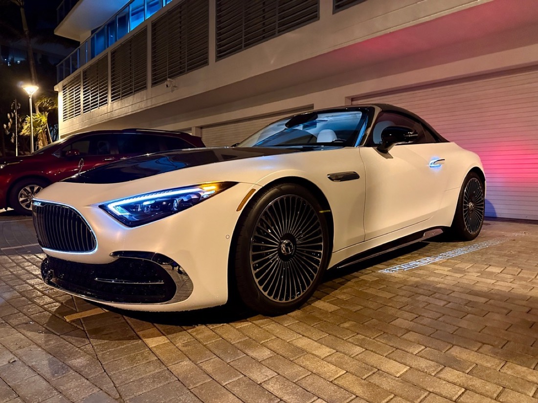 Detailed white Mercedes-AMG SL at dusk